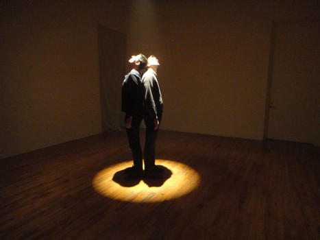 The 'Talent Show' at PS1 examines works that seemed to predict the rise of a participatory culture. Seen here: A pair of visitors stand beneath David Lamelas's 'Limits of  Projection,' from 1967.
